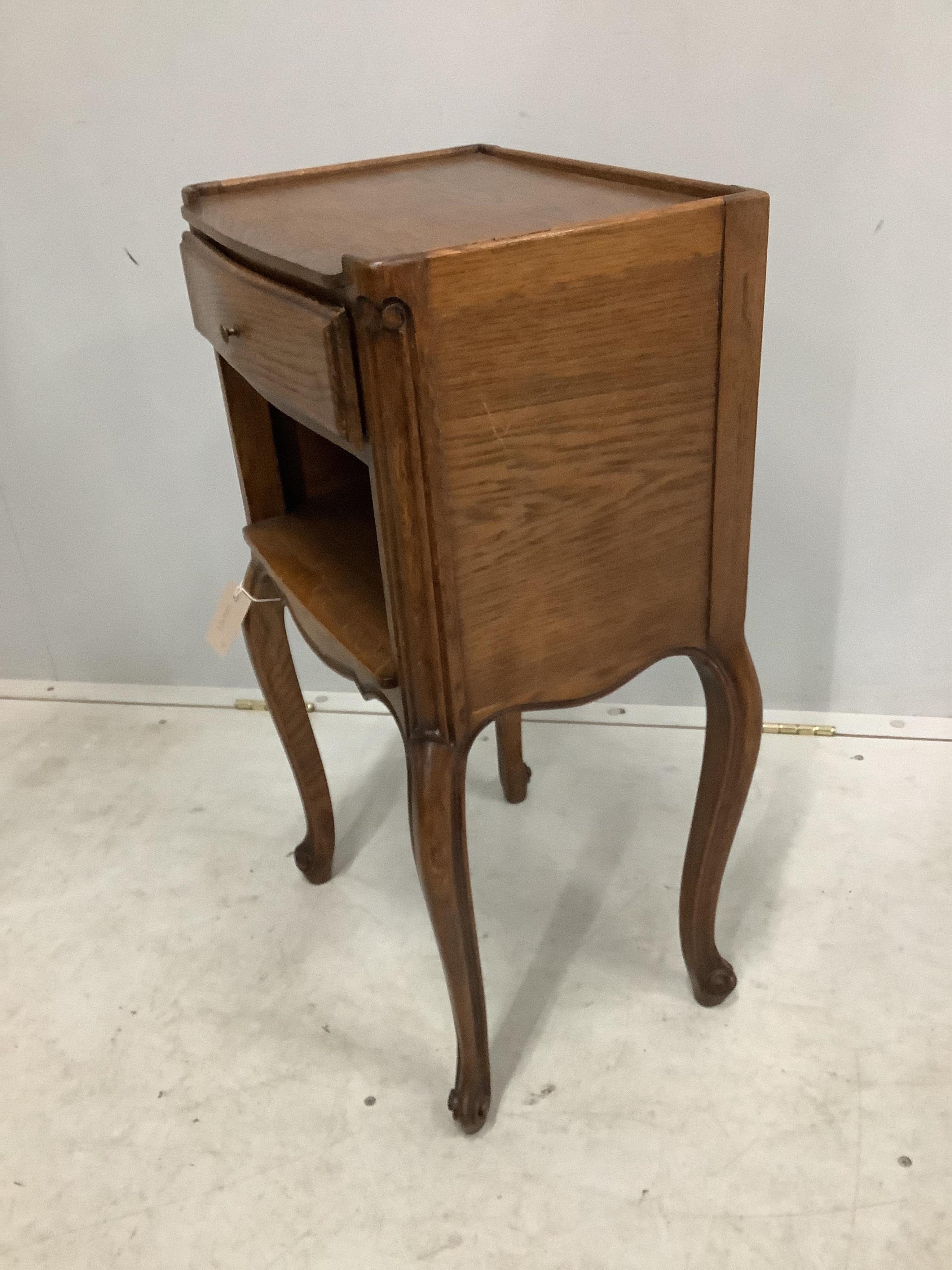 A pair of French oak bedside cabinets, width 38cm, depth 28cm, height 70cm. Condition - fair to good